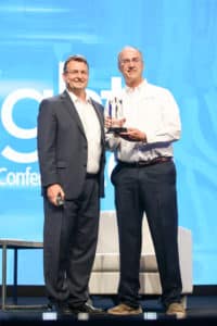 Ken Pincumbe (r), chief financial officer of BWF Envirotec USA, accepts the Rapid Time to Value Award from Epicor.